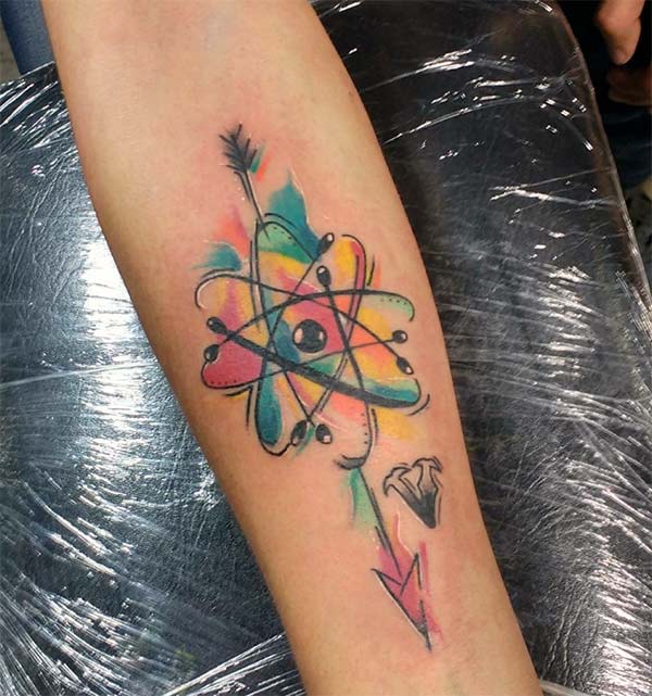 Atomic Tattoo with a blue, yellow arrow ink design on the lower arm brings the foxy look 
