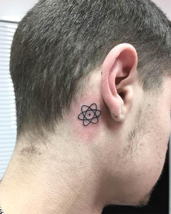 Atomic Tattoo on the back of the ear make a man look cute