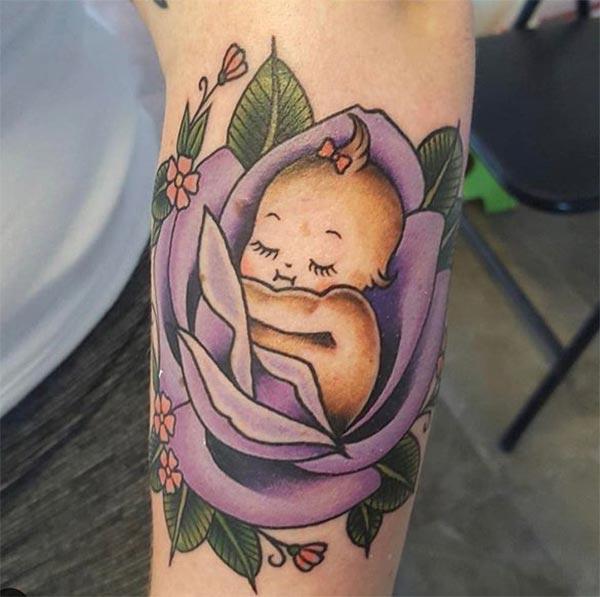 Baby tattoo on the lower front arm make beings the foxy look