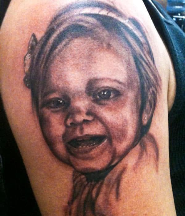 The Ink design in this Baby tattoo matches the skin color to make a man look magnificent