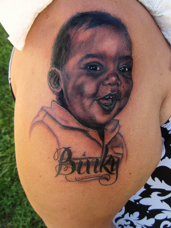 Baby tattoo on the right upper arm brings the moralistic look in men