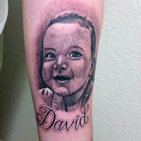 Baby tattoo for men with a dark ink design makes them look marvelous