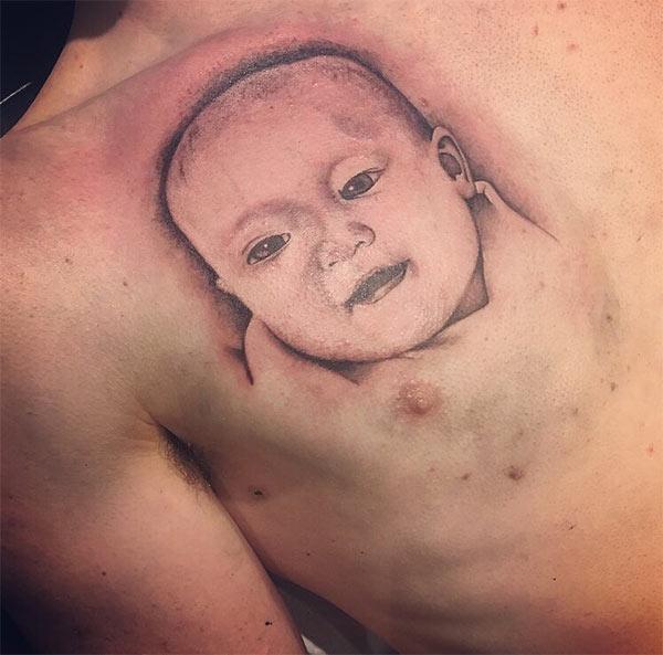 The bright ink design on the Baby tattoo on the upper chest make a man look majestic