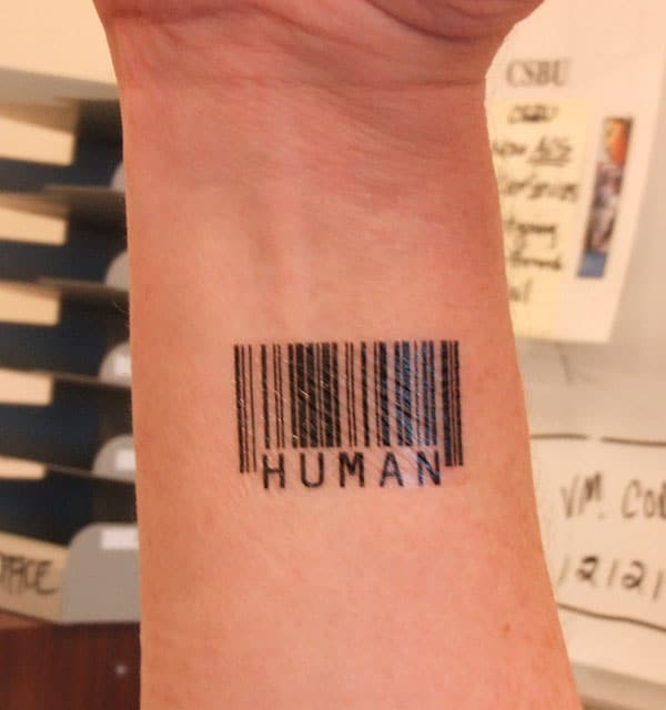 Barcode tattoo on the lower arm makes a man look gallant