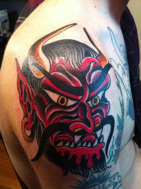 Devil Tattoo for men on the shoulder with a brown design ink makes a man look attractive