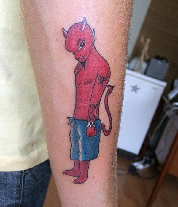 Devil Tattoo with a blue and pink ink design on the lower arm shows their foxy look