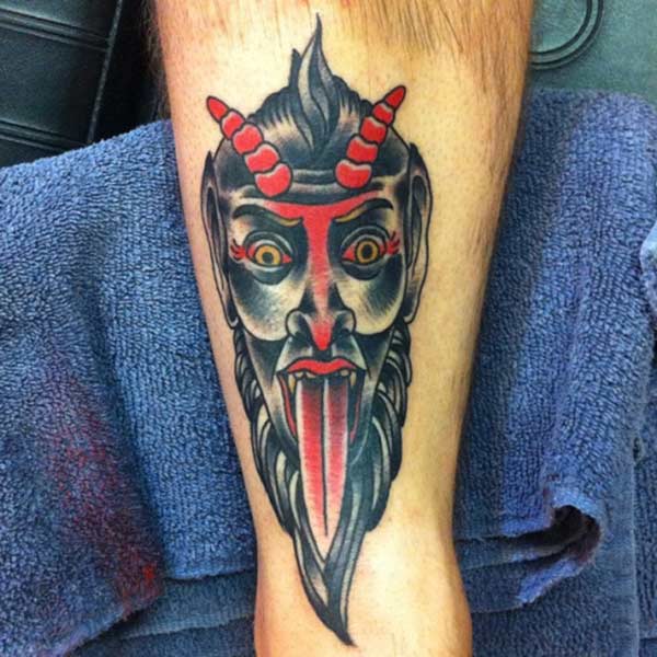 Devil Tattoo with a black ink design, on the foot brings the spruce appearance in men