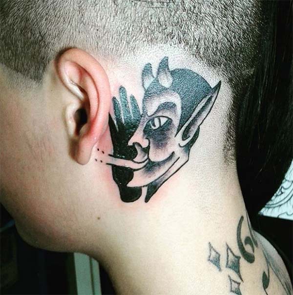 The Devil Tattoo on the side ear with a black ink design make a man look sw...