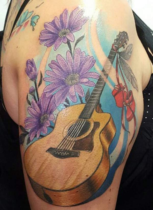 Guitar Tattoo on the shoulder brings the captivating look