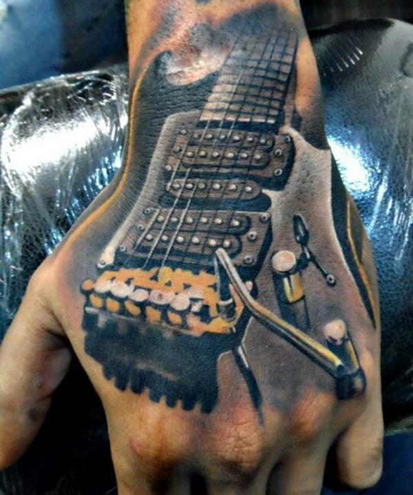 Guitar Tattoo on the hand makes a man look stylish
