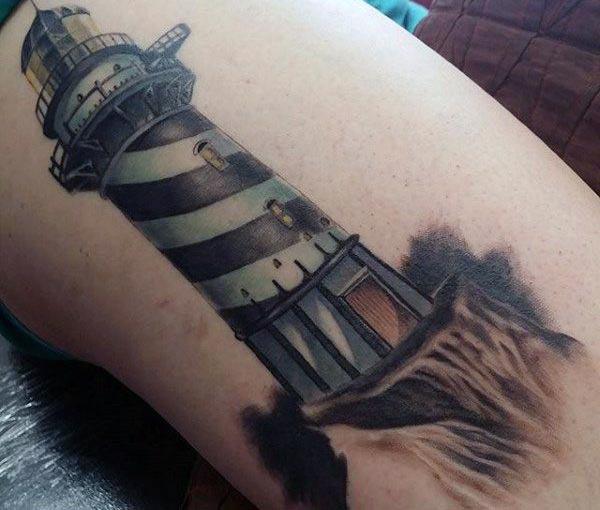 The Ink design in this Lighthouse Tattoo matches the skin color to make a man look magnificent 