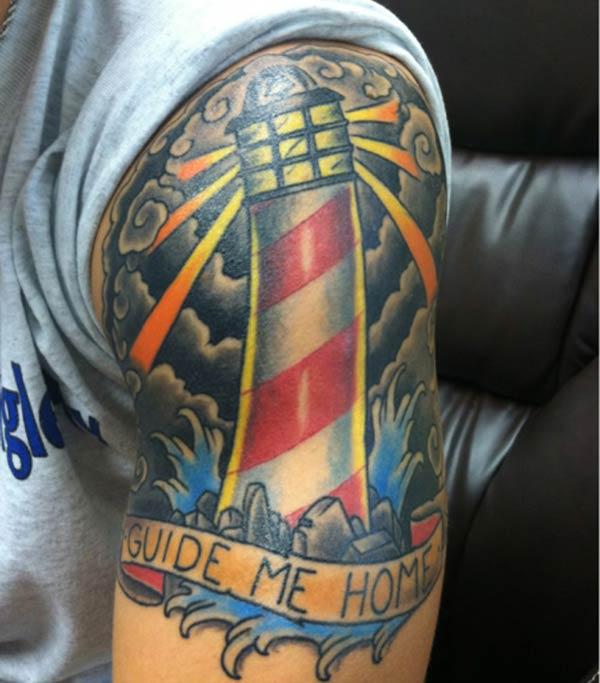 The Lighthouse Tattoo on the shoulder make a man look hypnotic 