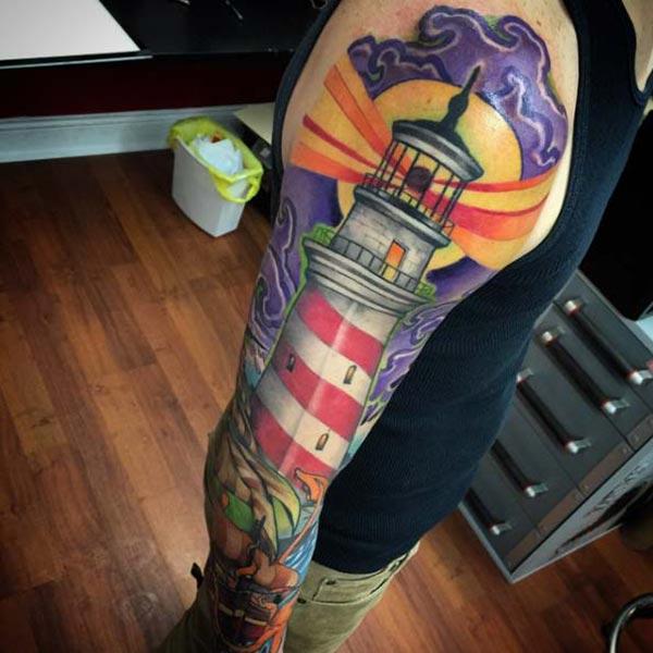 Lighthouse Tattoo on the right arm make a man appear foxy