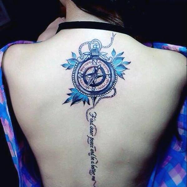 mesmerizing compass with blue leaves tattoo design on back for Women