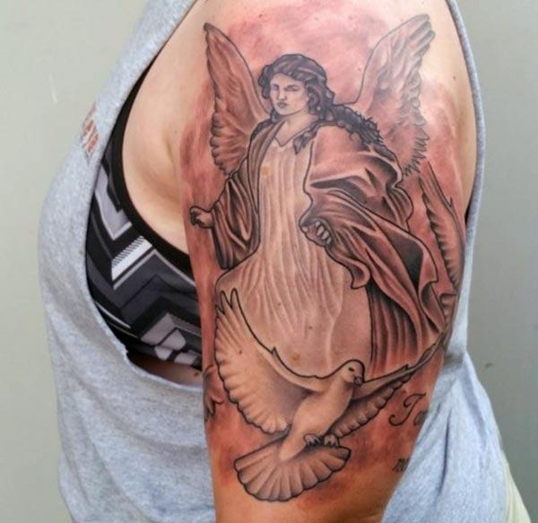 Angel tattoo on the shoulder brings the dapper look in a man