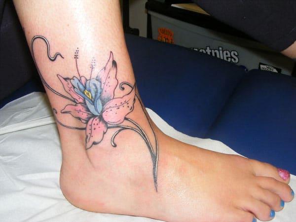 This flower ink design of the Ankle tattoo matches the skin color to make a man look admirable