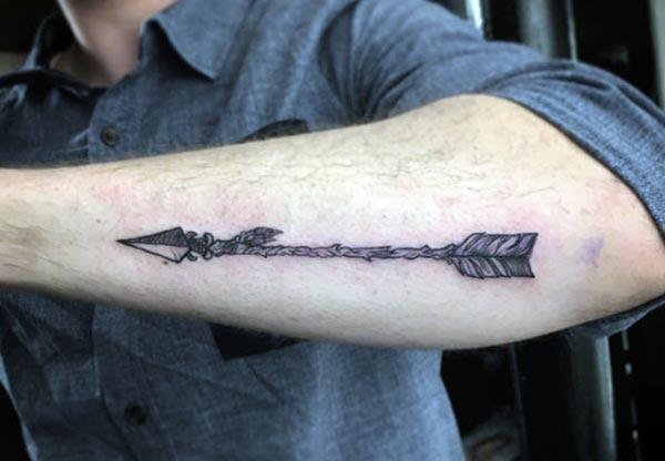 Arrow Tattoo on the arm makes a man look gallant