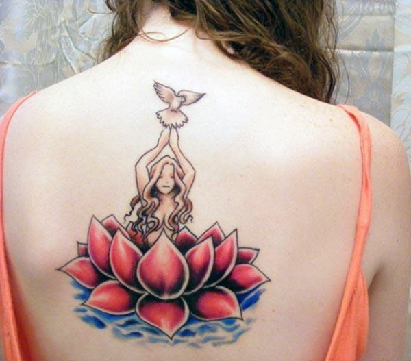 Back Tattoo with a pink flower ink design makes a lady look captivating
