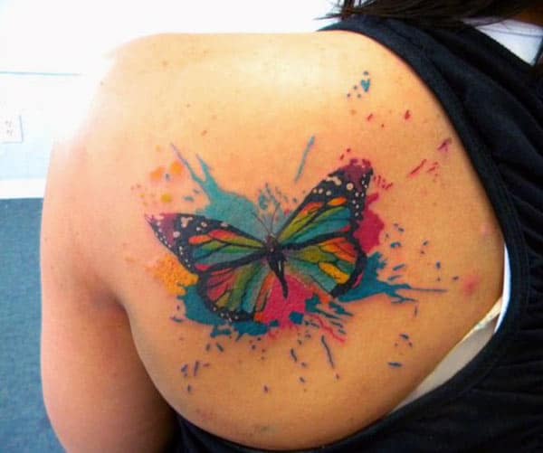 Butterfly tattoo with black and pink ink design brings a gorgeous look