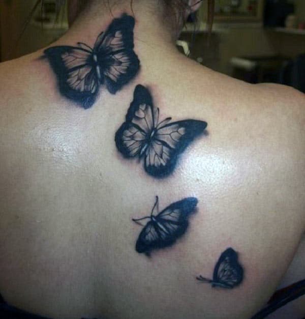 Butterfly tattoo on the back makes a woman appear sexy