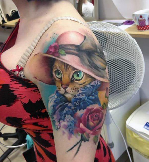 This Cat tattoo design with a colorful blue and brown ink makes the left arm look fabulous 