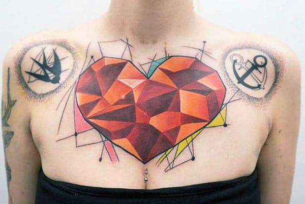 Chest tattoo with an orange ink, diamond design brings the feminist look