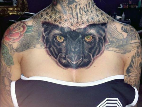 Chest tattoo with a black ink design makes a woman look captivating