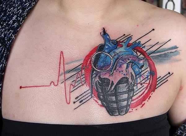 Chest tattoo with a heart ink design brings the captivating look