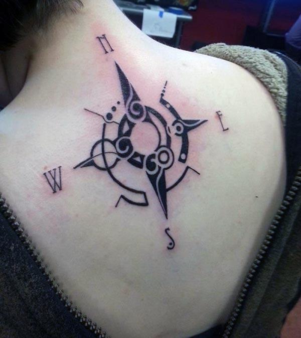 Compass tattoo with a black ink design make girls look alluring