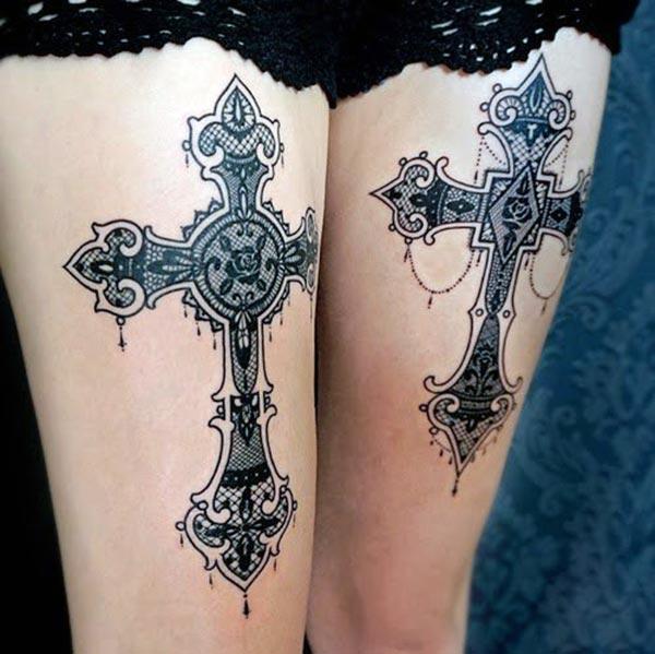 Thighs designed with cross tattoos makes a girl attractive