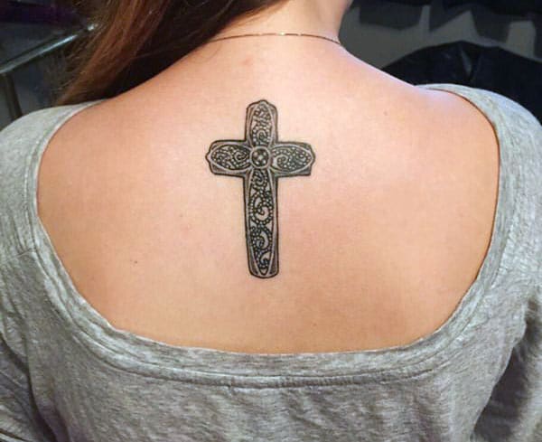 Cross tattoo at the back of girls gives a sexy look