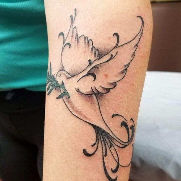 Dove Tattoo on the lower arm brings the mesmeric look