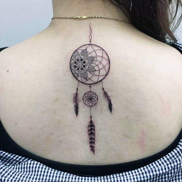 Dreamcatcher tattoo with a brown ink design make them look pretty