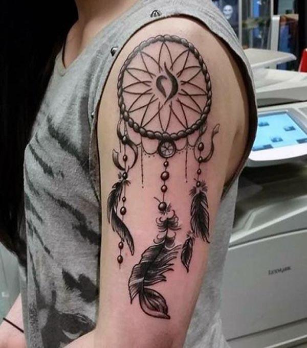 Dreamcatcher tattoo for the shoulder gives the captive look in girls