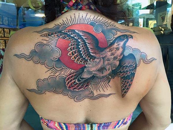 Brown ink design of the Eagle tattoo on the back neck of girls make them look attractive