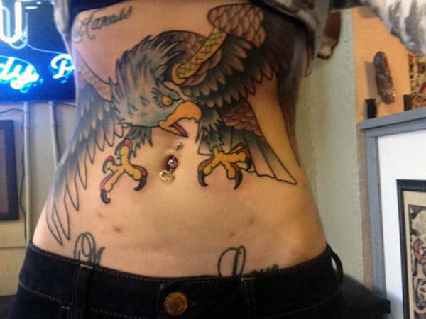 Eagle tattoo with a brown ink design makes girls to appear gorgeous 