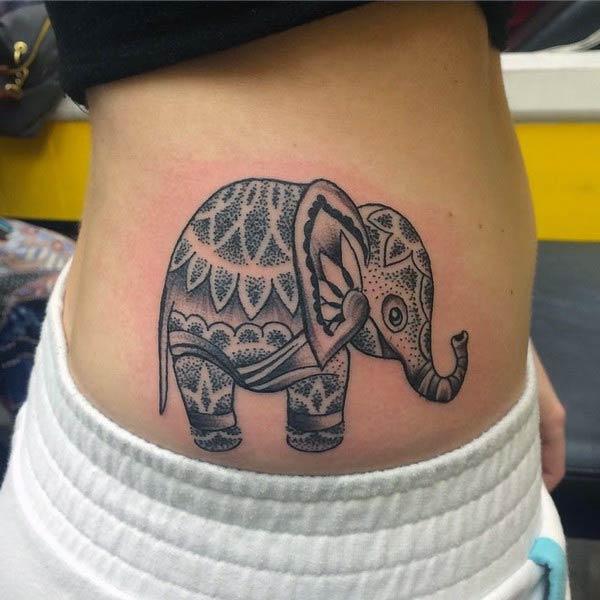 Elephant tattoo on the side belly makes a girl alluring
