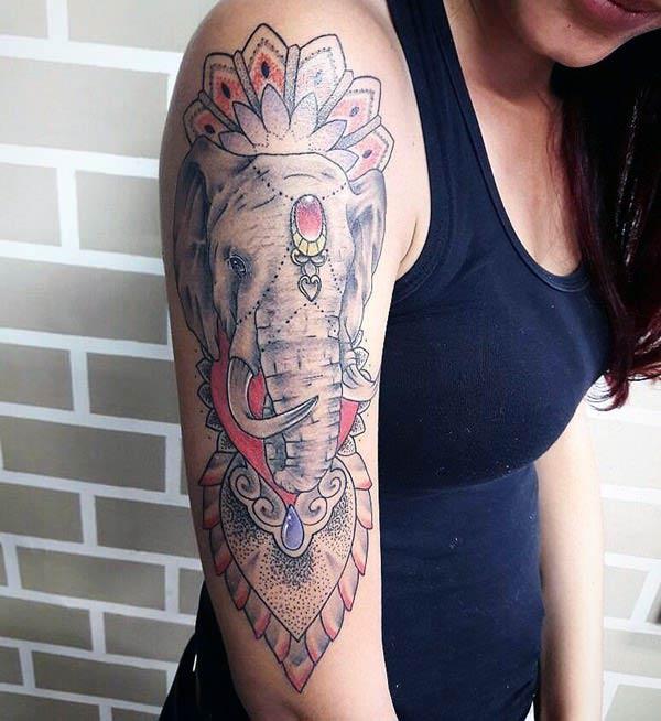 Elephant tattoo with a brown ink design make them look alluring 