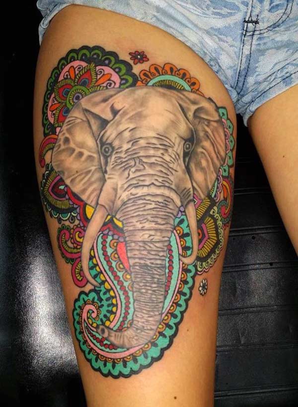 Elephant tattoo on the thigh makes a woman look captivating