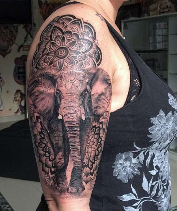 Elephant tattoo on the shoulder makes a woman look captivating