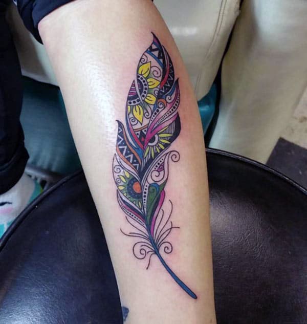 Feather tattoo on the upper arm make them look splendid