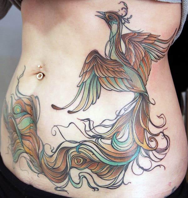 Phoenix tattoo on the side belly makes a women look attractive