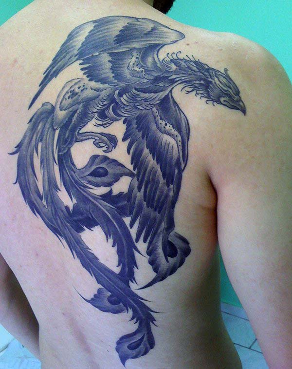 Phoenix tattoo with a black ink design makes a man look cute