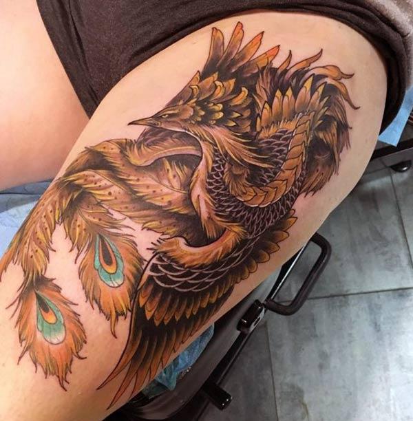 Phoenix tattoo on the side thigh gives the girls look sexy and captivating