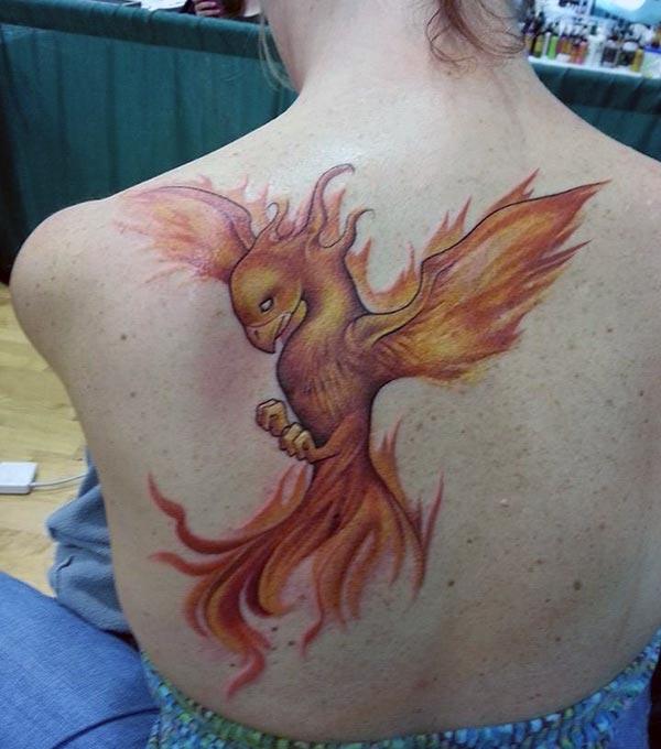 Purple ink design of the Phoenix tattoo on the back of ladies make them look attractive