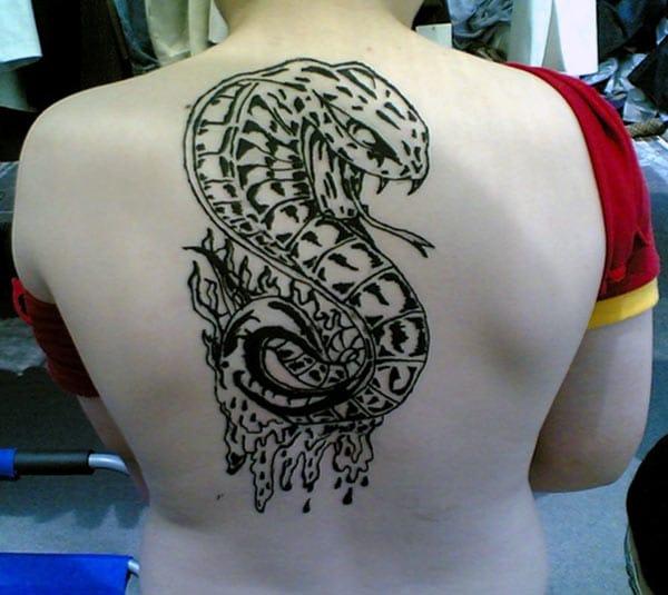 Snake tattoo on the back make a girl attractive and elegant