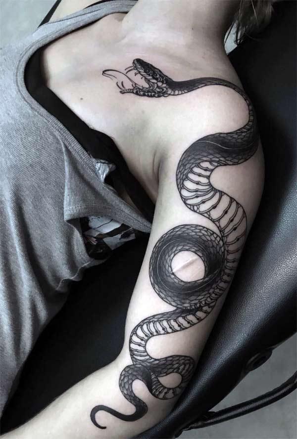 This snake tattoo design with a colorful ink makes the left arm look fabulous