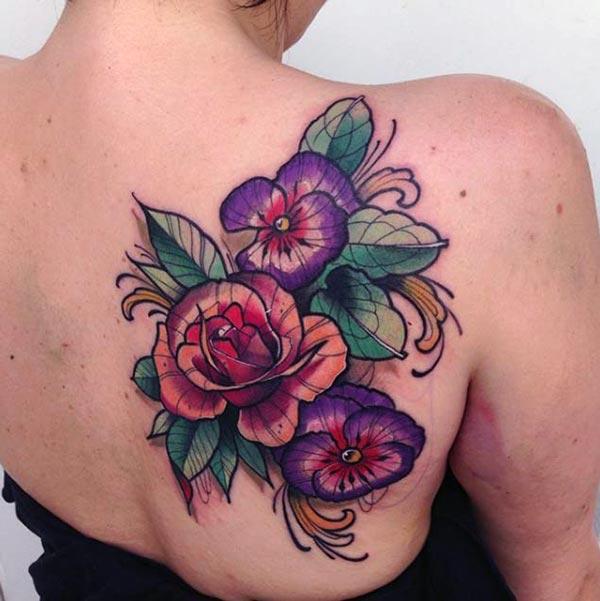 The flower tattoo with pink and purple ink design makes girls have magnificent look