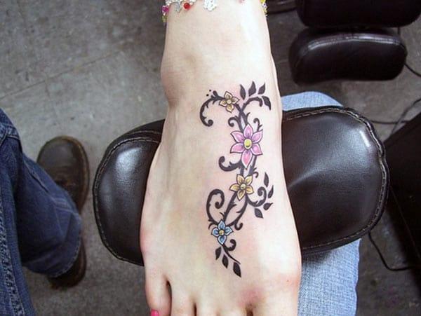 Foot tattoo with a flower ink design brings the astonishing look