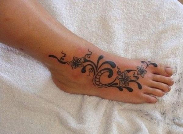 Flower tattoo for women with a dark ink design makes them look marvelous